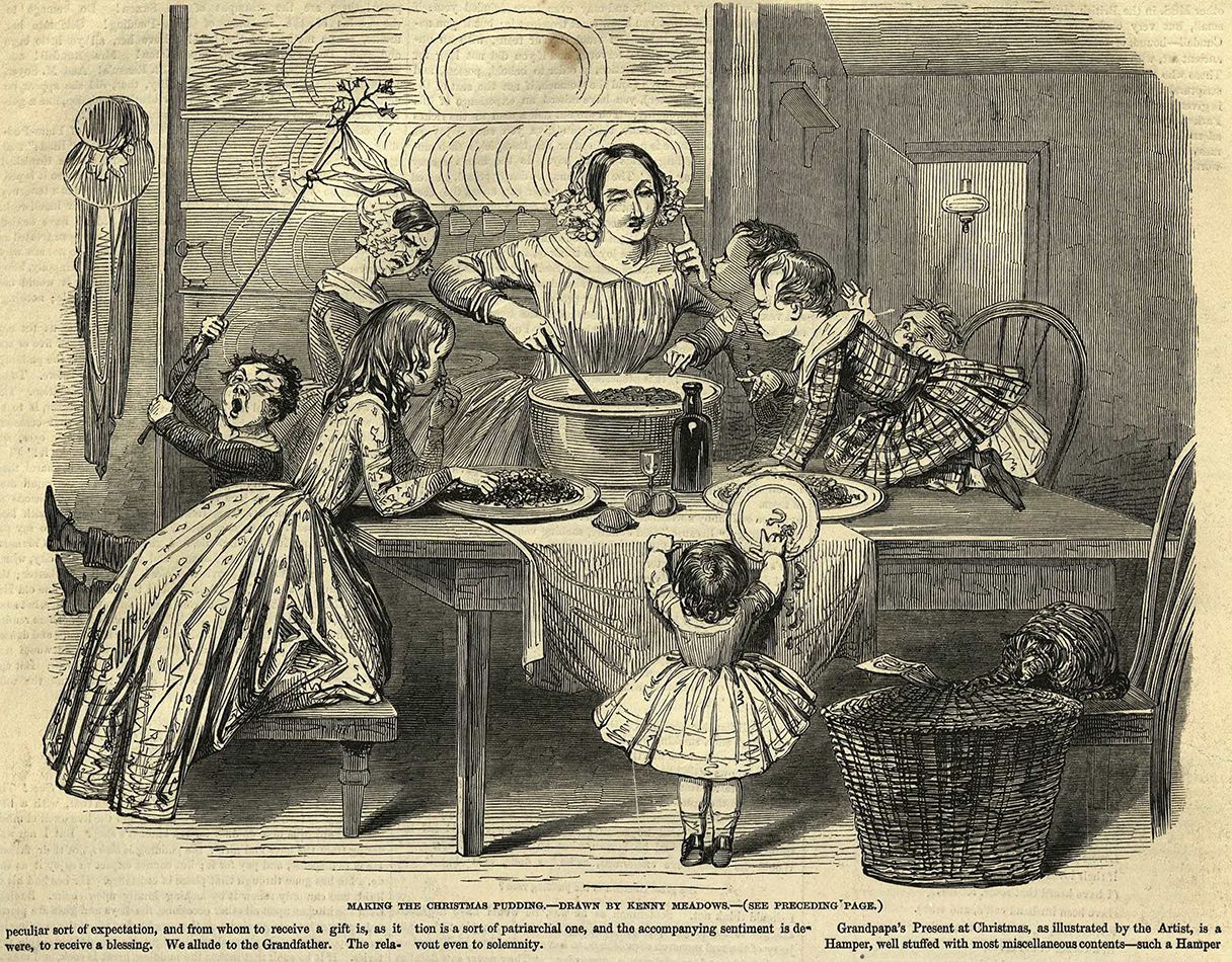una famiglia vittoriana cucina il Christmas pudding
