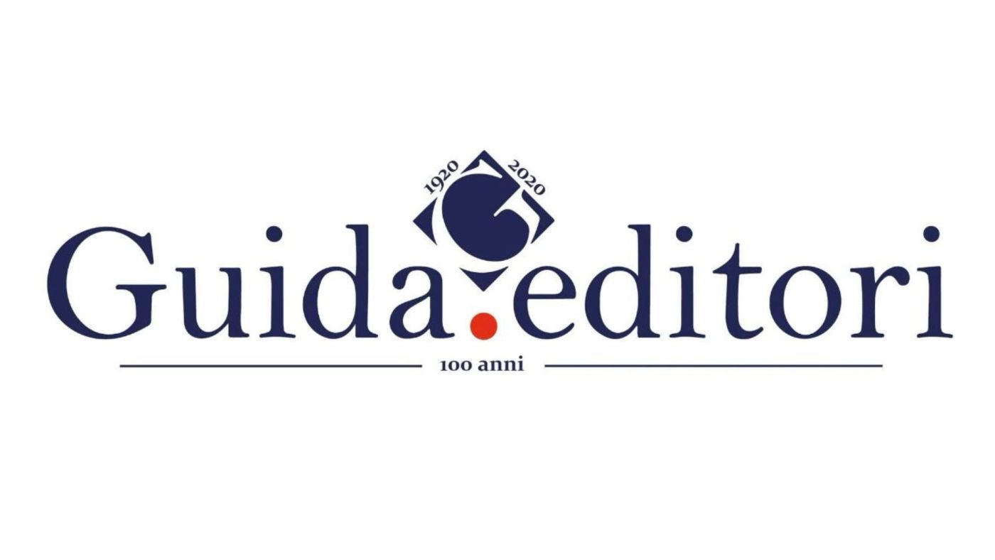 Logo di Guida Editori su sfondo gradiente con la scritta 'Dal cuore di Napoli a Londra: 100 anni di cultura'