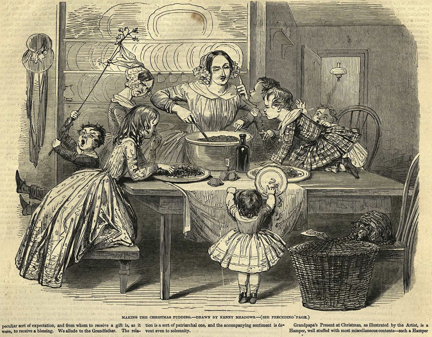 una famiglia vittoriana cucina il Christmas pudding
